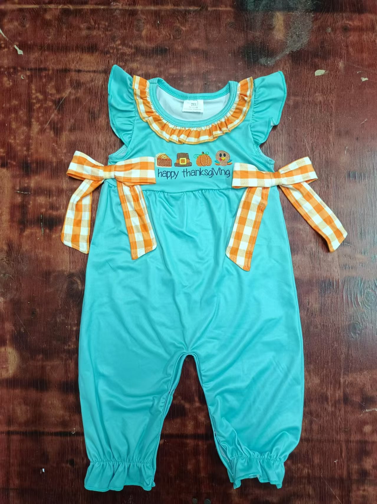 Custom moq 3 eta 6-7weeks Orange plaid bow decorated lake blue flying sleeves trousers romper