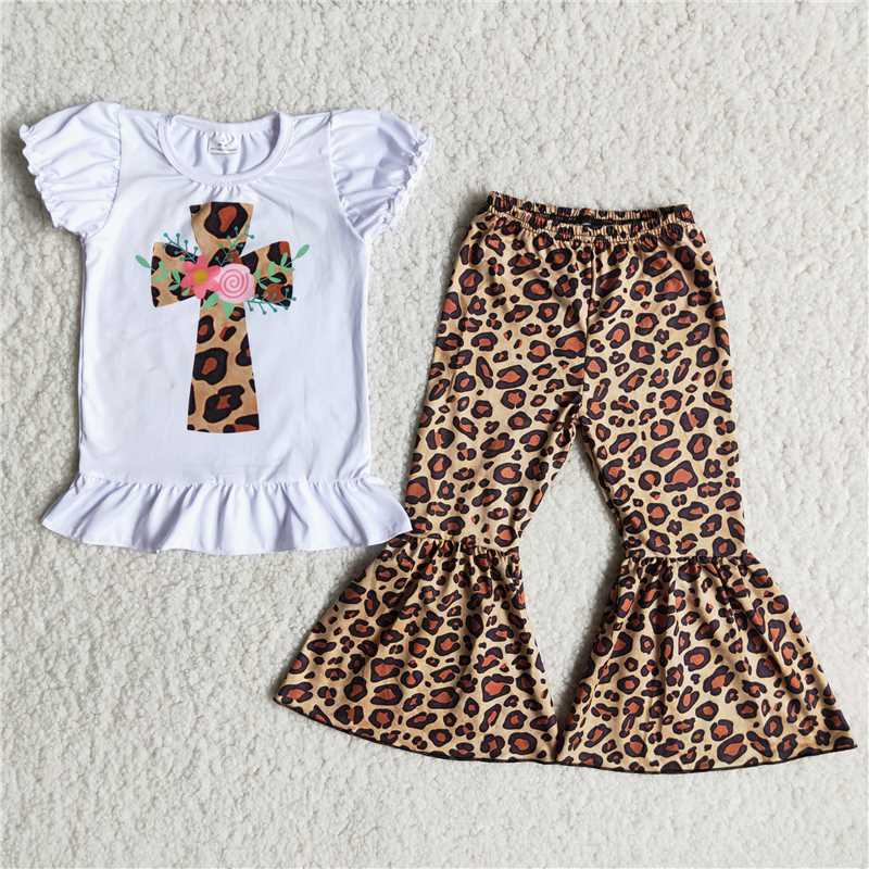 cross white top with Leopard print pants