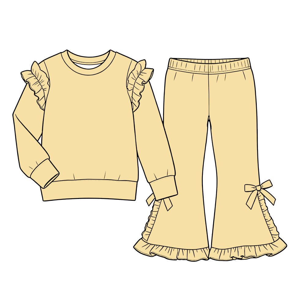 Custom moq 5  cotton fabric girls ruffle sets  solid color blank Pale yellow long-sleeved sweatshirt with ruffled trim and matching slightly flared trousers featuring side bows