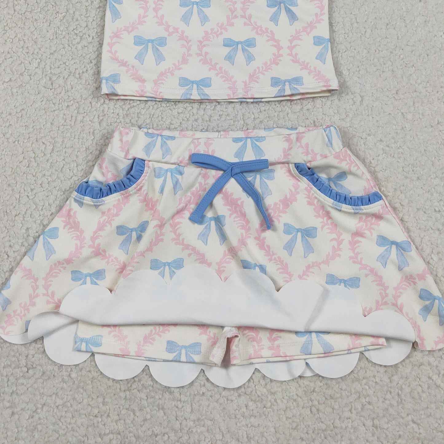 RTS NO MOQ milk silk GSD3727 Baby Girls Strap Bow Floral Top Scallop Pocket Skort Active Set
