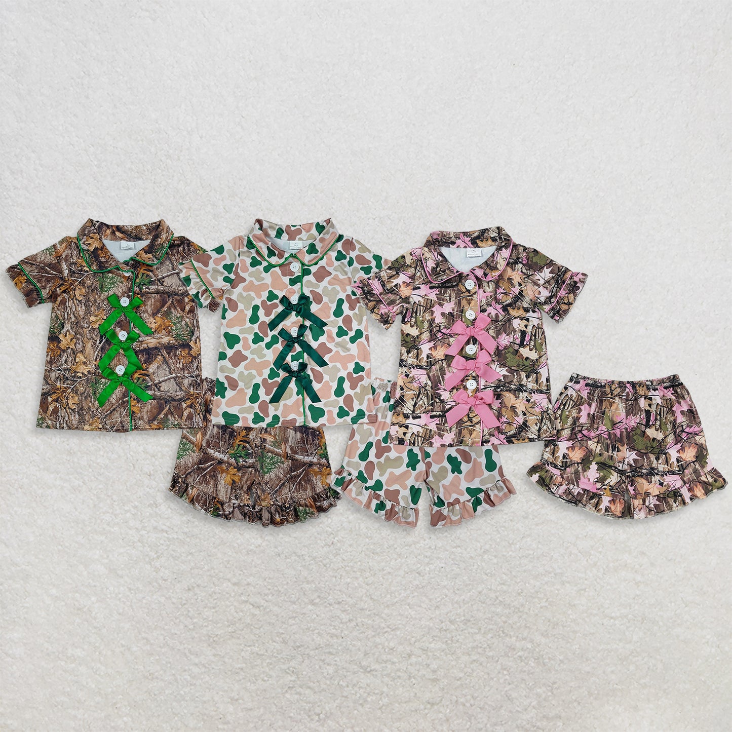 RTS NO MOQ Sibling milk silk Baby Girls Camo Print Bow Button Front Short Sleeve Top Ruffle Hem Shorts Summer Sleep Pajamas Set