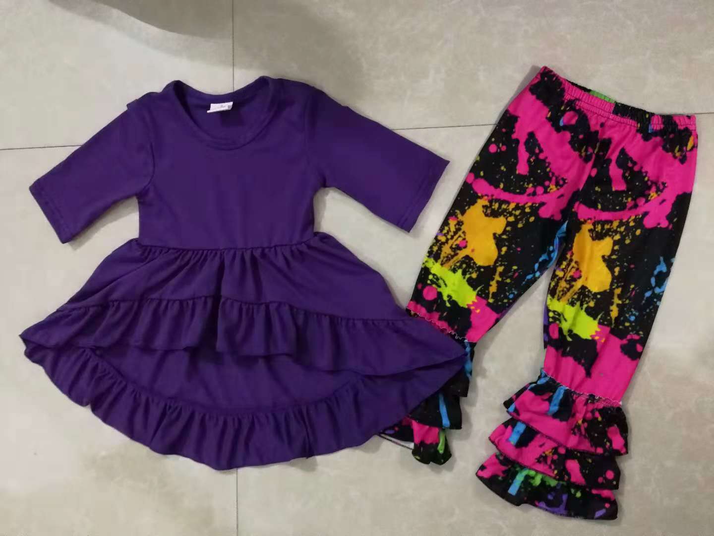 Purple top and colorful pants